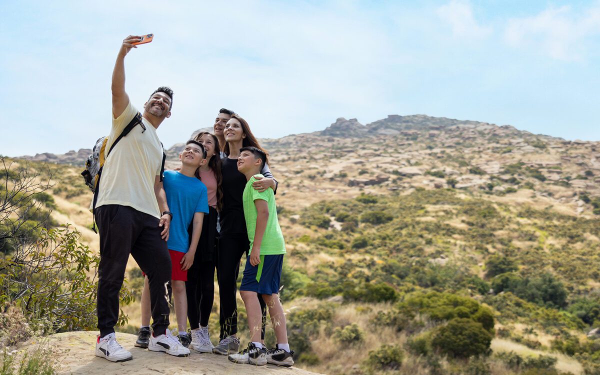 Family taking a selfie on a hike