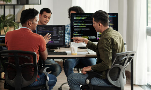 Developers Discussing Programming Code